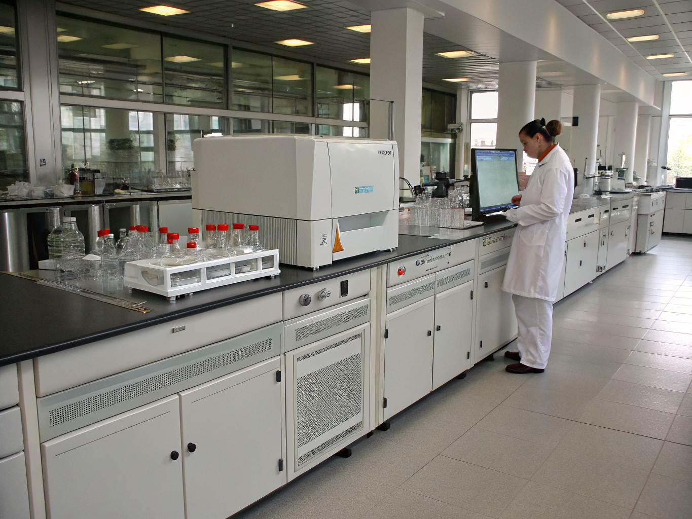 Ayurvedic analytical laboratory with botanical extracts and chromatography equipment